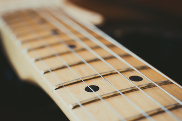 Electric guitar neck detail, music symbol