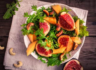 Fig and melon salad with mizuna above