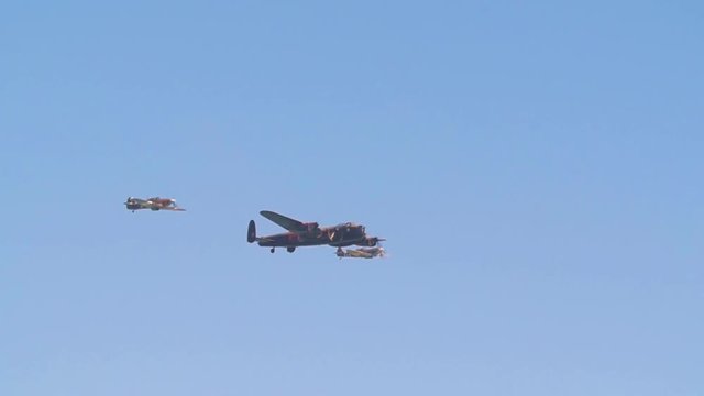 Slow motion display of world war two bombers and fighters