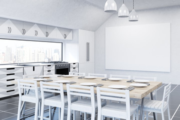 Kitchen with fridge, TV set and gray furniture