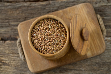 buckwheat groats on wooden surface