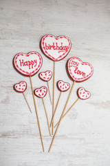 Funny and colorful gingerbread shapes on sticks.Happy Birthday