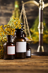 Obraz na płótnie Canvas Herbal medicine on wooden desk background