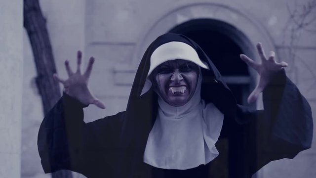 zombie nun. devilish woman in nun costume walking around the temple. halloween