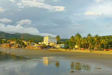 beachfront scene san juan del sur nicaragua with restaurants and hotels on pacific ocean