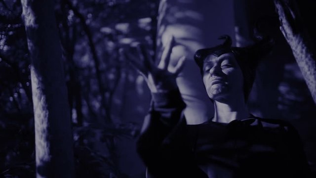 horned witch ghost walks through the ruins of the castle. halloween Horror