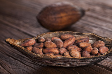 Cocoa pod on wooden background