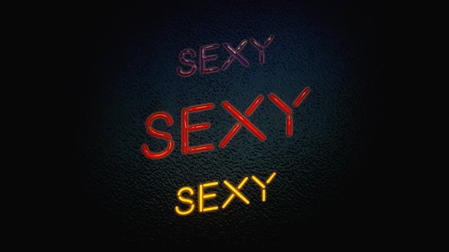 A neon sign turning on and off, over a wall, with the text Sexy. Embossed style.
