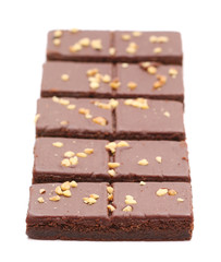 Chocolate Brownies with Nuts on Top on a White Background