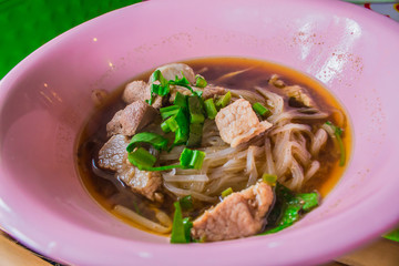 Noodles in a bowl of pink.