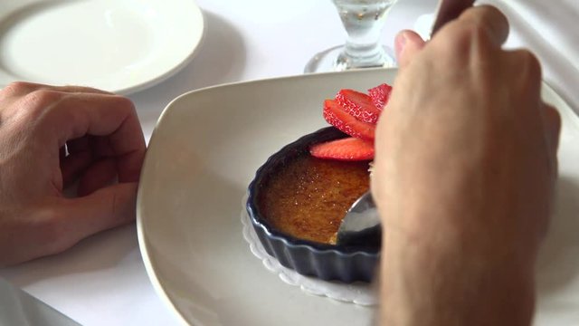 A person eating a gourmet dessert