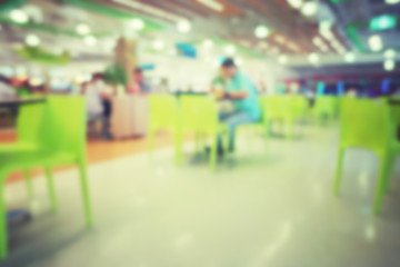 blured people in food court , vintage tone abstract background
