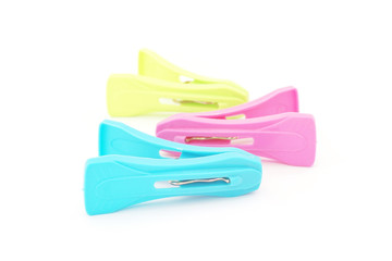 plastic clothespins on white background