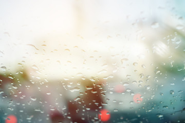 double exposure of blurred cityscape during traffic jam and raindrop ,abstract background