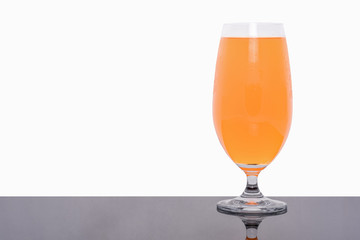 Glass of fresh orange juice isolated on white background