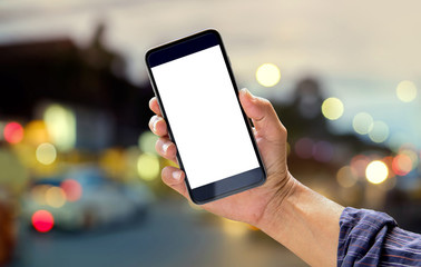 Smart phone showing blank screen in man hand at walk street,night light bokeh Background