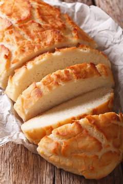 Dutch crunch bread sliced close-up. vertical, rustic
