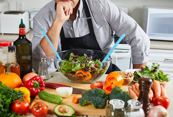 Chef man cooking in the kitchen.