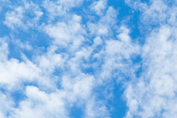 blue sky background with tiny clouds