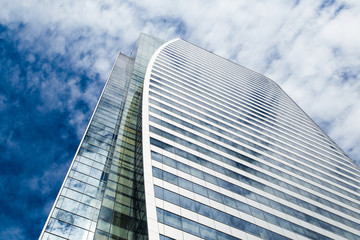 Business building , sky and tiny clouds