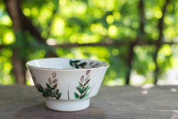 Cup on wood background.