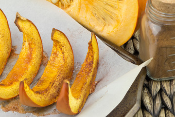 Pumpkin slices baked with cinnamon and sugar. Thanksgiving dinner. Fall harvest. Fall festival.