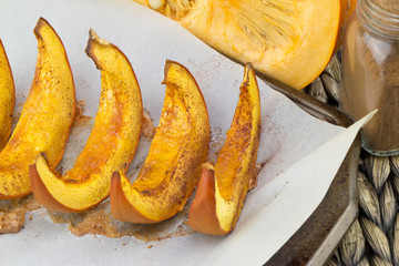 Pumpkin slices baked with cinnamon and sugar. Thanksgiving dinner. Fall harvest. Fall festival.