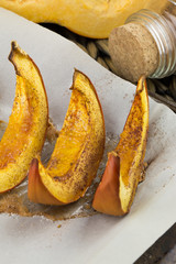 Pumpkin slices baked with cinnamon and sugar. Thanksgiving dinner. Fall harvest. Fall festival.
