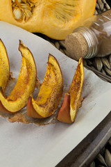 Pumpkin slices baked with cinnamon and sugar. Thanksgiving dinner. Fall harvest. Fall festival.