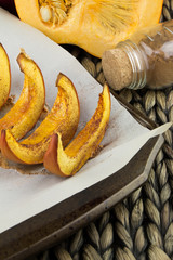 Pumpkin slices baked with cinnamon and sugar. Thanksgiving dinner. Fall harvest. Fall festival.