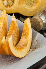Pumpkin slices baked with cinnamon and sugar. Thanksgiving dinner. Fall harvest. Fall festival.