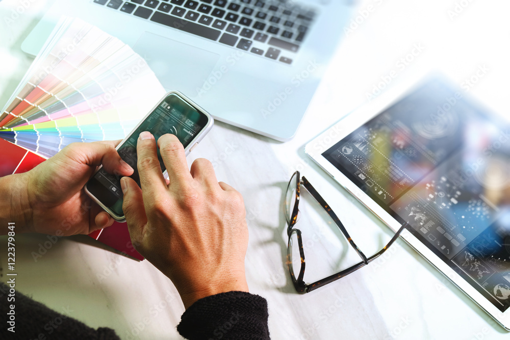 Poster website designer working digital tablet and computer laptop with