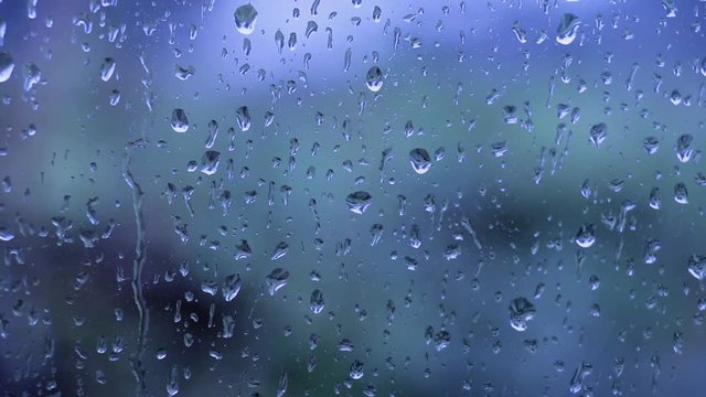view of raindrops falling on a window