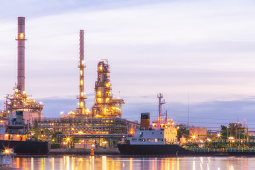 Obraz na płótnie Canvas Oil refinery plant at twilight with copy space.