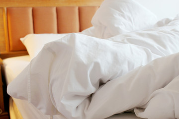 Fototapeta na wymiar wrinkled blanket on bed