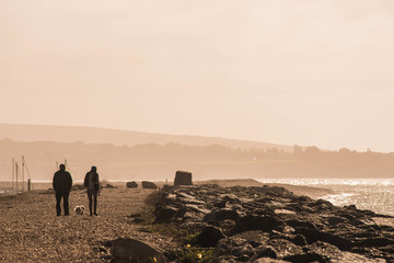 couple walking on the coast