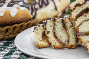 Homemade cinnabons cinnamon cut bun with cream cheese glaze and chocolate icing