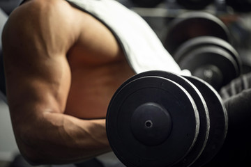 Close up of a dumbbell in hands