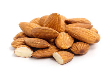 Heap of almond nuts isolated on white background