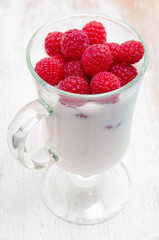 Healthy breakfast with yogurt and berry, selective focus