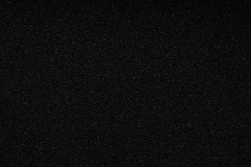 Black monotone grain texture. Glitter sand background.