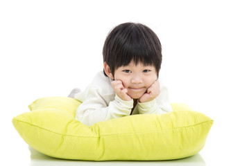 Cute Asian chid lying on big pillow