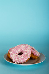 Iced doughnut on a light blue background