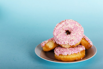 Iced doughnut on a light blue background