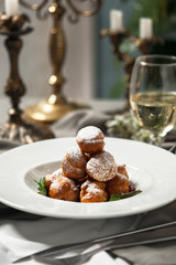 Profiteroles with whipped cream and powdered sugar
