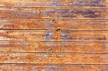 Orange weathered wood house wall
