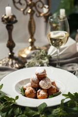 Profiteroles with whipped cream and powdered sugar