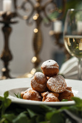 Profiteroles with whipped cream and powdered sugar