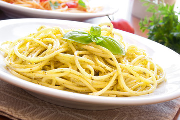 Spaghetti pasta with pesto sauce