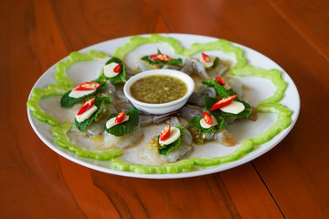 spicy raw shrimp in fish sauce on white plate, Thai food (selective focus)